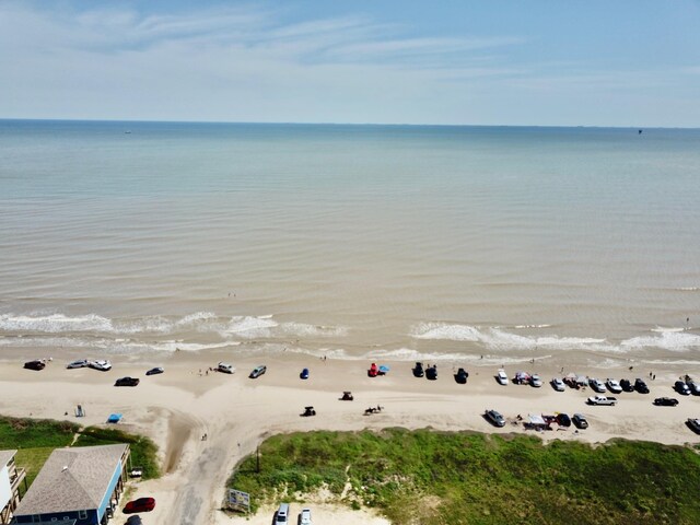 aerial view featuring a water view and a beach view