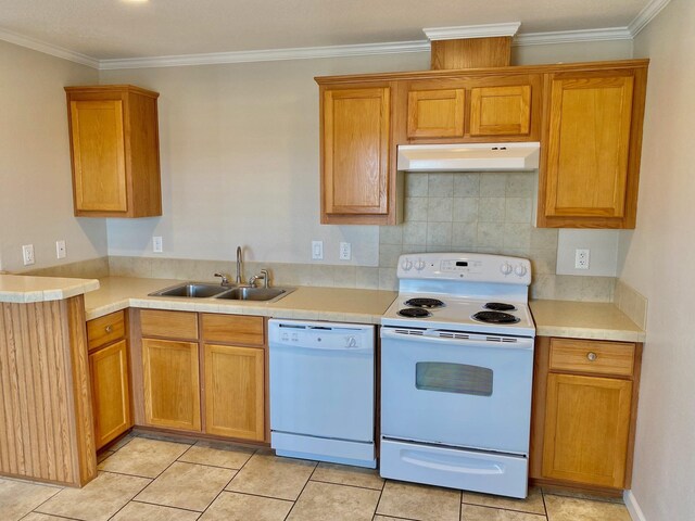 kitchen with under cabinet range hood, white appliances, a sink, light countertops, and ornamental molding