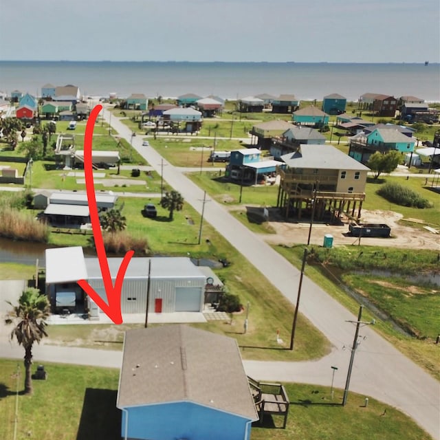 bird's eye view with a water view and a residential view