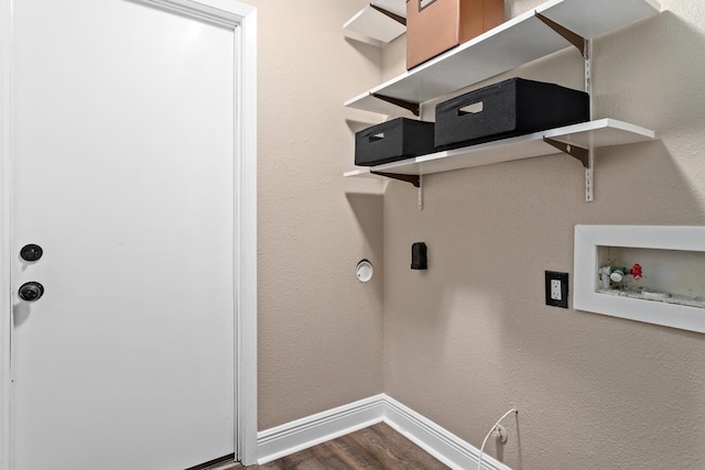 clothes washing area with gas dryer hookup, dark hardwood / wood-style flooring, and washer hookup