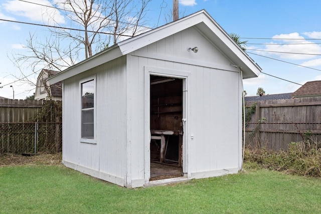 view of outbuilding with a lawn