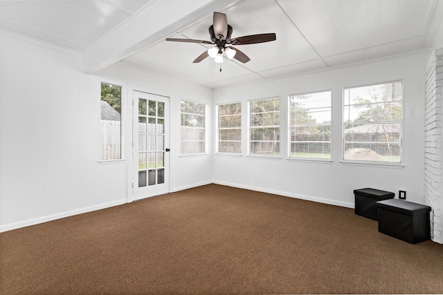 unfurnished sunroom featuring ceiling fan