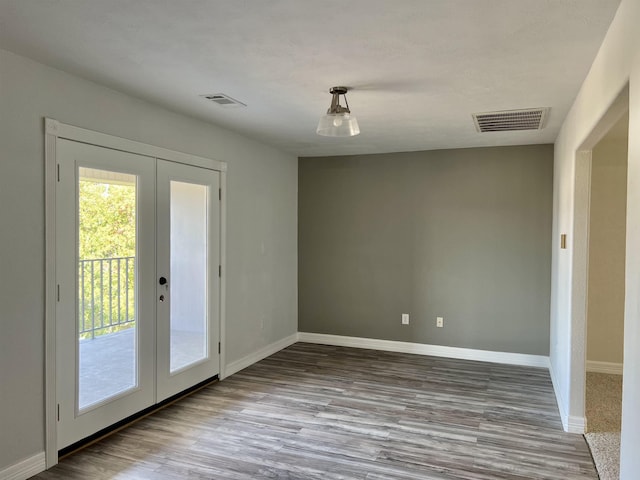 doorway to outside with french doors and light hardwood / wood-style floors