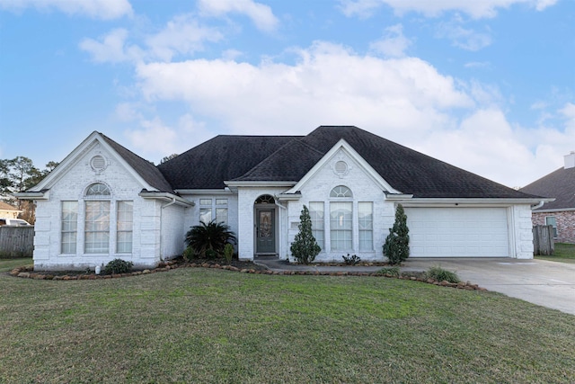 view of front facade featuring a garage and a front lawn