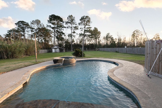 view of pool with a lawn and an in ground hot tub