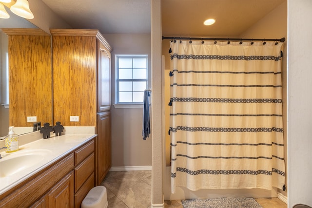 bathroom with tile patterned flooring, vanity, and curtained shower