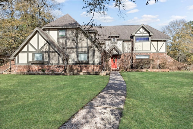 tudor-style house with a front lawn