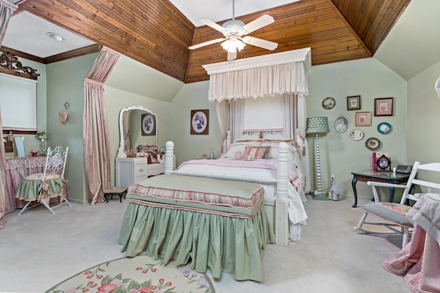 carpeted bedroom with vaulted ceiling, ceiling fan, and crown molding