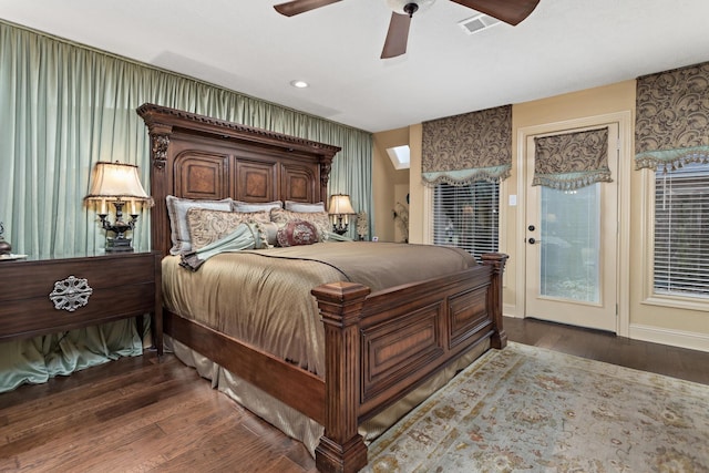 bedroom featuring ceiling fan, dark hardwood / wood-style flooring, and access to outside