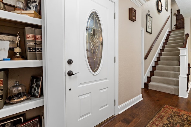 entrance foyer with dark hardwood / wood-style floors