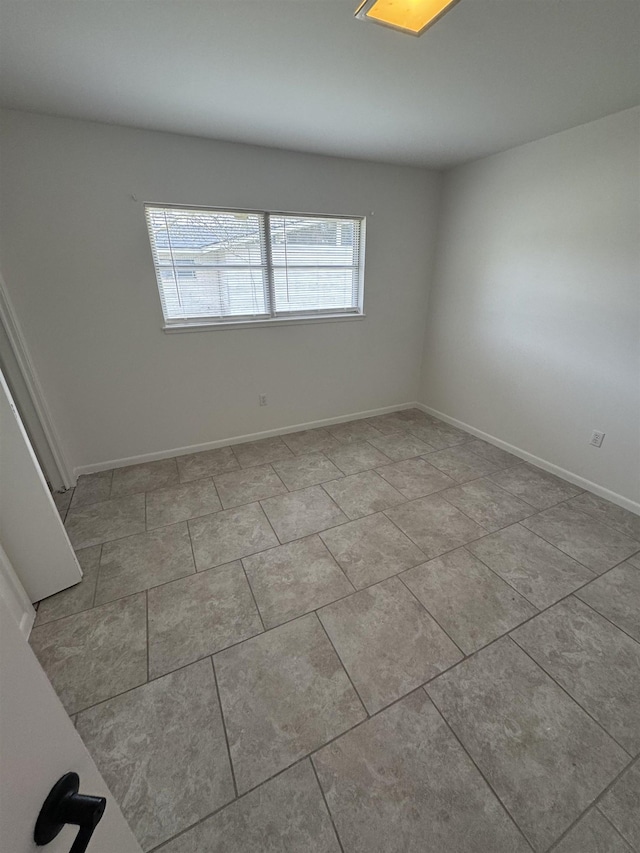 view of tiled spare room