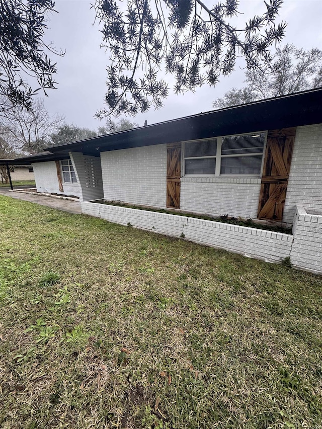 view of home's exterior with a lawn