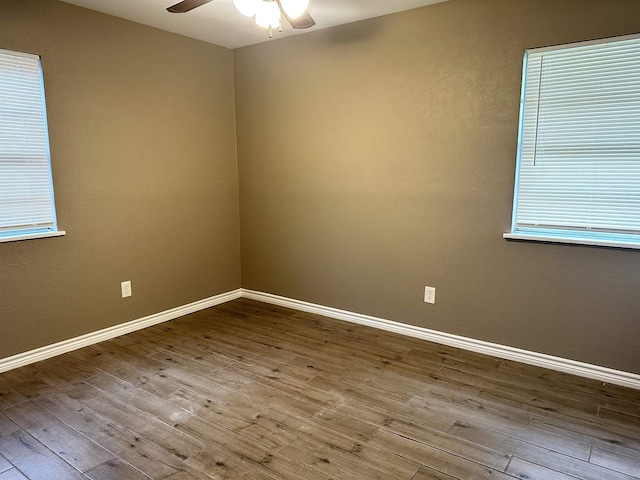 7165 Lewis Dr, Beaumont, TX 77708 - unfurnished room with ceiling fan, wood finished floors, and baseboards