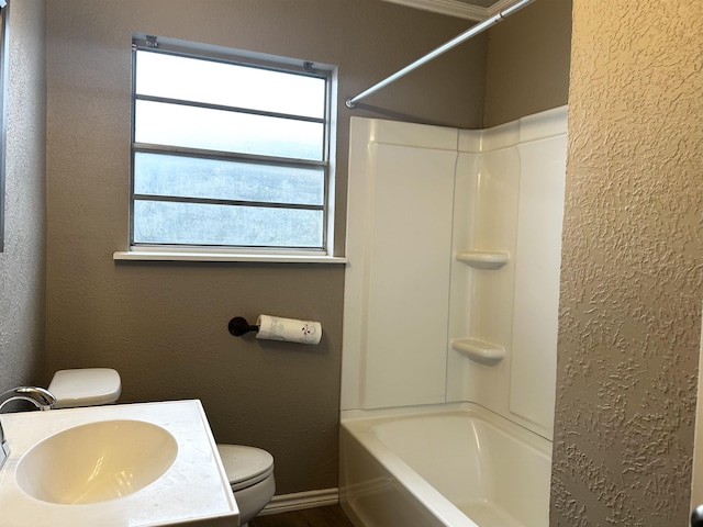 7165 Lewis Dr, Beaumont, TX 77708 - full bath with a textured wall, toilet, healthy amount of natural light, shower / bathtub combination, and vanity