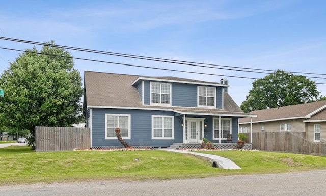 view of front facade featuring a front yard and covered porch