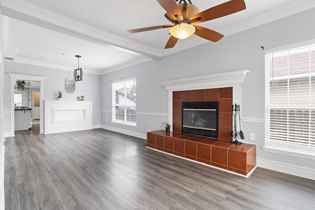 unfurnished living room featuring a fireplace, dark hardwood / wood-style flooring, ceiling fan, and ornamental molding