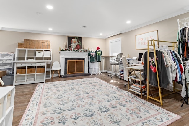 interior space with hardwood / wood-style floors and crown molding