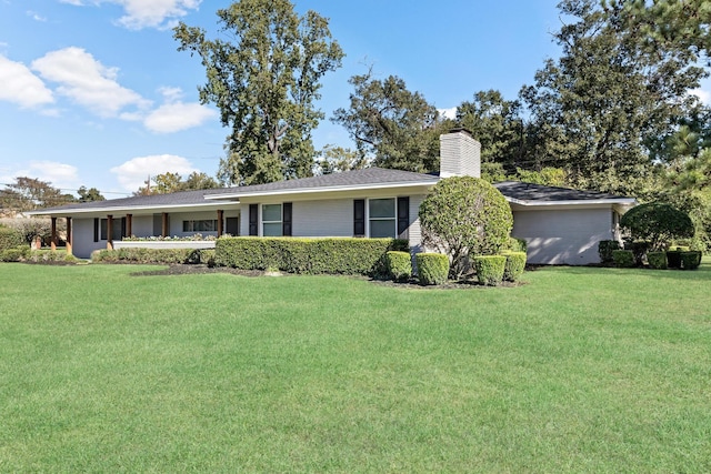 ranch-style home featuring a front yard