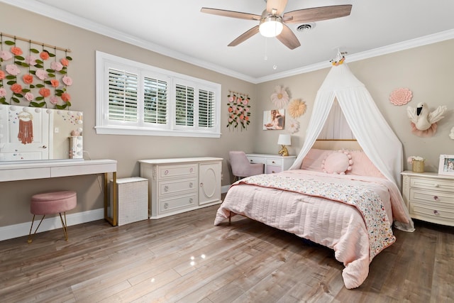 bedroom with wood-type flooring, ceiling fan, and ornamental molding