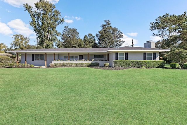 ranch-style house featuring a front lawn