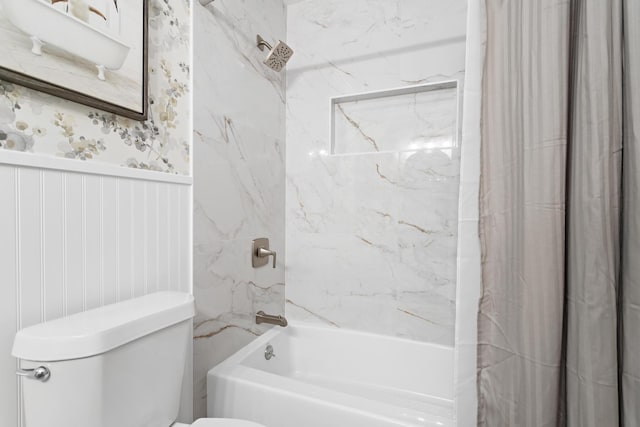 bathroom featuring toilet and shower / bathtub combination with curtain