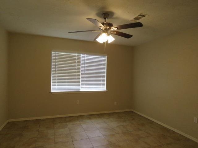 800 Cactus St, Bridge City, TX 77611 - empty room featuring a ceiling fan and baseboards