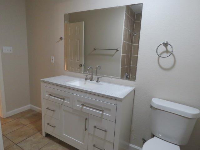 800 Cactus St, Bridge City, TX 77611 - full bath featuring vanity, tile patterned flooring, and a shower