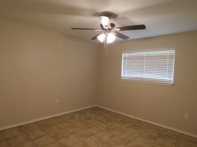 800 Cactus St, Bridge City, TX 77611 - spare room featuring a ceiling fan and baseboards