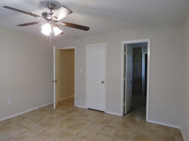800 Cactus St, Bridge City, TX 77611 - unfurnished bedroom with baseboards and ceiling fan