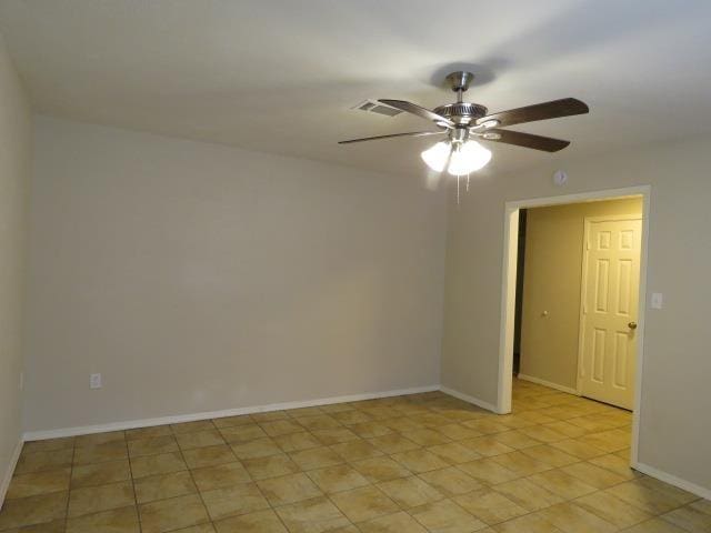 800 Cactus St, Bridge City, TX 77611 - empty room featuring ceiling fan and baseboards
