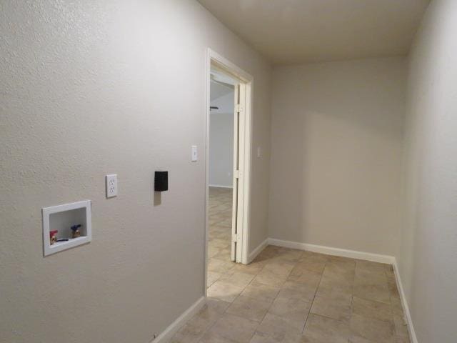 800 Cactus St, Bridge City, TX 77611 - laundry area featuring washer hookup and light tile patterned flooring