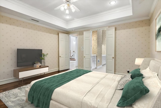 bedroom featuring dark hardwood / wood-style floors, a raised ceiling, ceiling fan, and ornamental molding