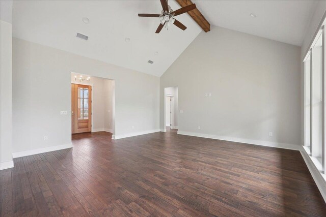 empty room with visible vents, beamed ceiling, baseboards, ceiling fan with notable chandelier, and dark wood-style floors