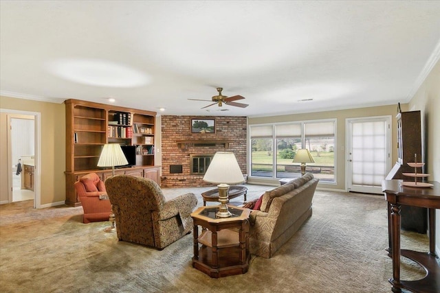 living room with carpet flooring, ceiling fan, a fireplace, and ornamental molding