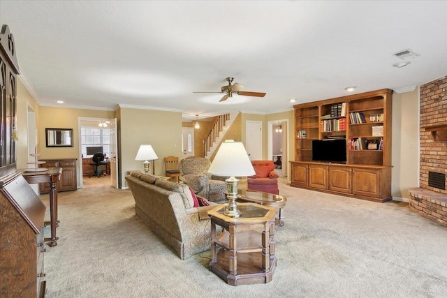 living room featuring light carpet, a fireplace, ceiling fan, and ornamental molding