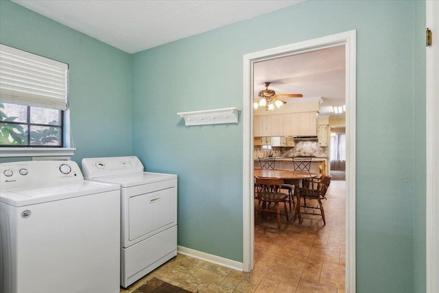 clothes washing area with separate washer and dryer, ceiling fan, and a healthy amount of sunlight