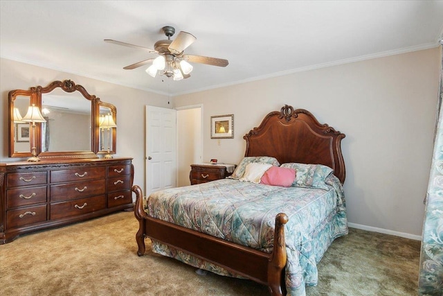 carpeted bedroom with ceiling fan and crown molding