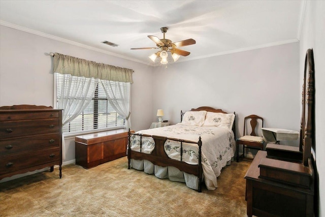 carpeted bedroom featuring ceiling fan and crown molding