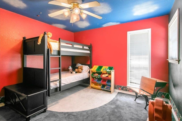 bedroom with ceiling fan and carpet