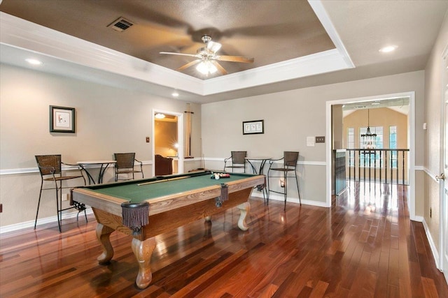 playroom featuring crown molding, pool table, dark hardwood / wood-style floors, and a raised ceiling