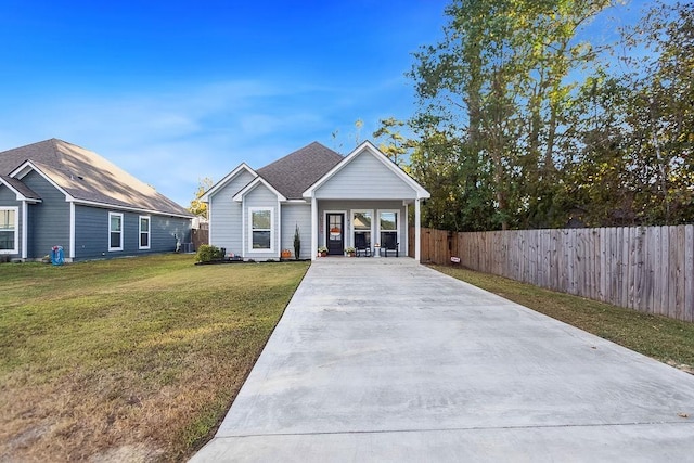 view of front of home with a porch and a front yard