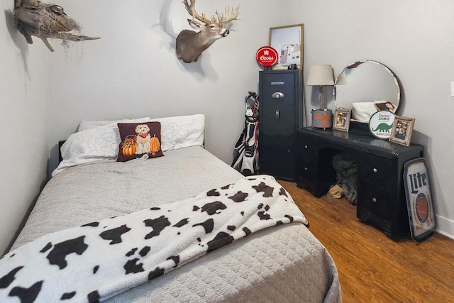 bedroom with hardwood / wood-style floors