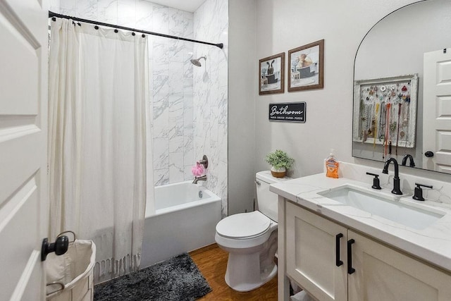 full bathroom with wood-type flooring, vanity, toilet, and shower / bath combo with shower curtain