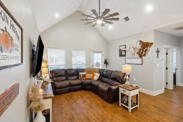 living room with ceiling fan, high vaulted ceiling, and wood-type flooring