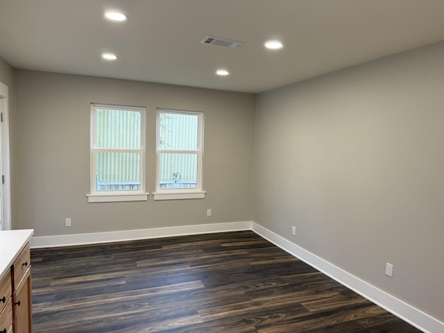 390 W Park St, Vidor, TX 77662 - unfurnished room featuring recessed lighting, dark wood-type flooring, and baseboards