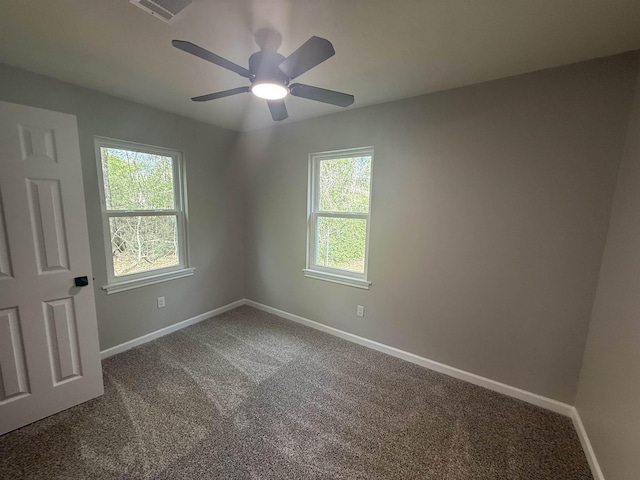 390 W Park St, Vidor, TX 77662 - empty room with carpet, healthy amount of natural light, baseboards, and ceiling fan