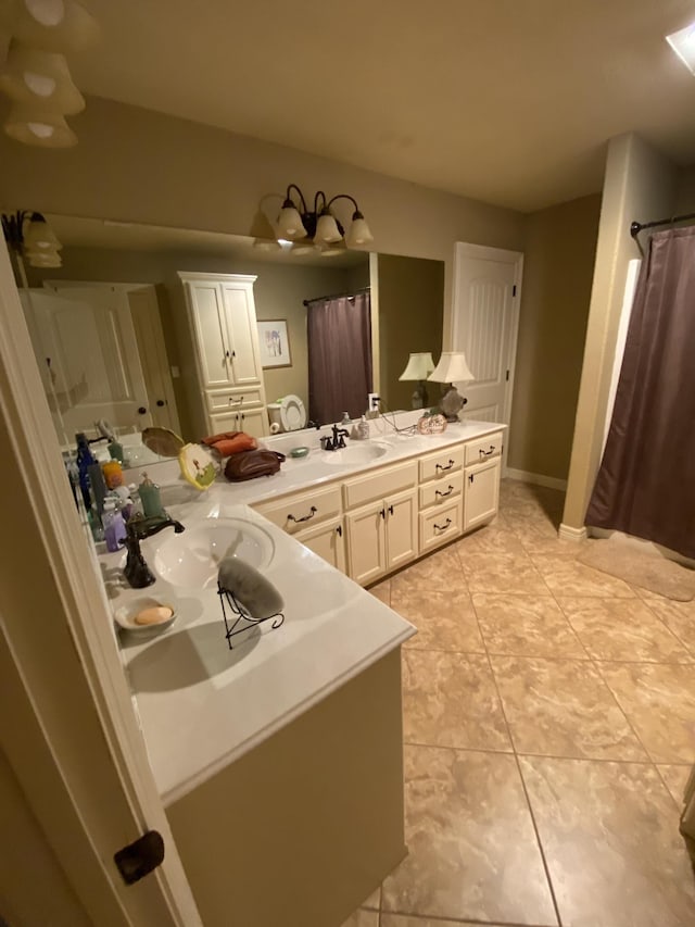 bathroom with tile patterned flooring and vanity