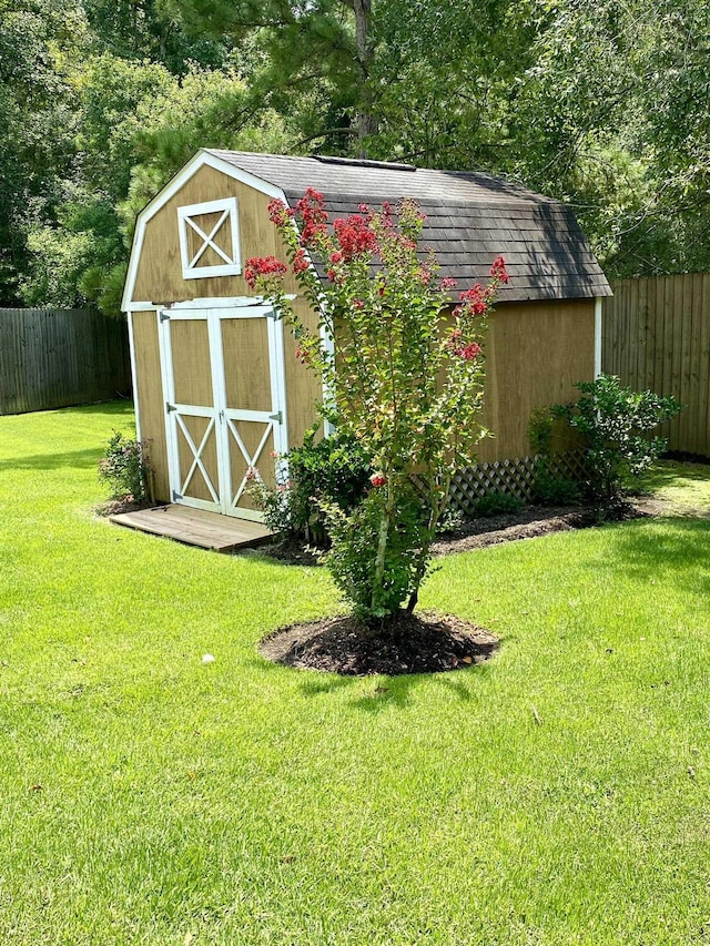 view of outdoor structure featuring a lawn