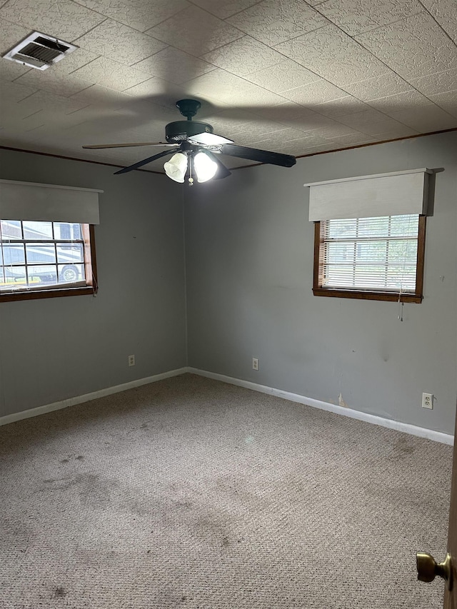 carpeted empty room with ceiling fan