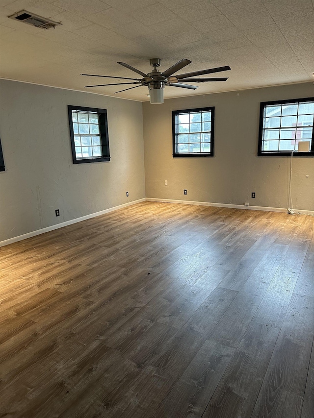 spare room featuring wood-type flooring